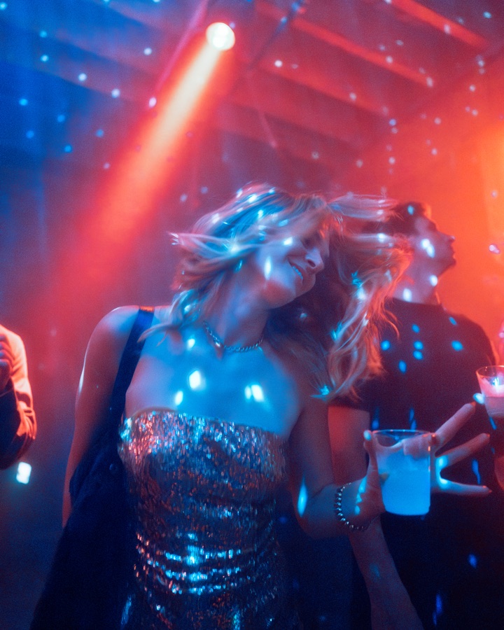Guest moving beneath blue and red light